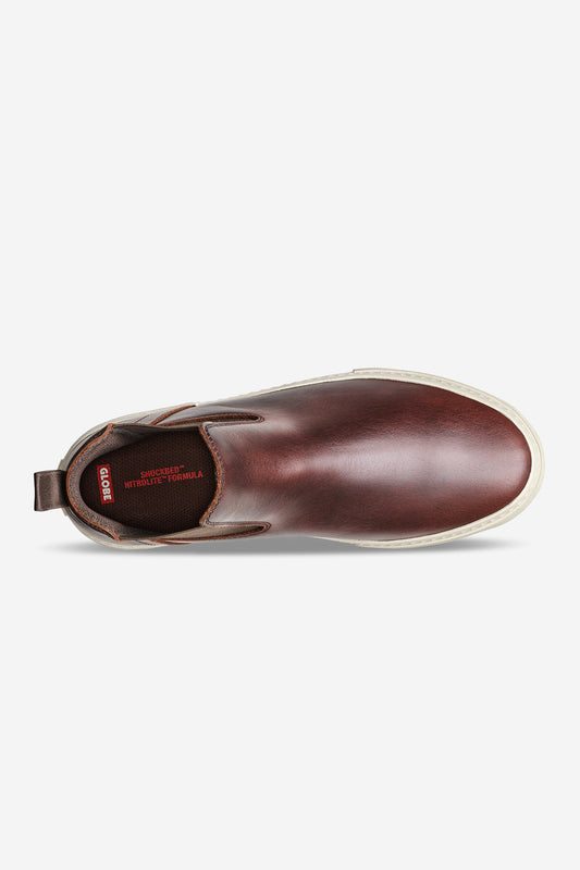 Top view of the Dover II - Oxblood, a brown leather slip-on shoe with white sole, brown elastic side panels, pull tab at the heel, and dark insole with red text—blending classic Chelsea Boot inspiration with skateboarding style.