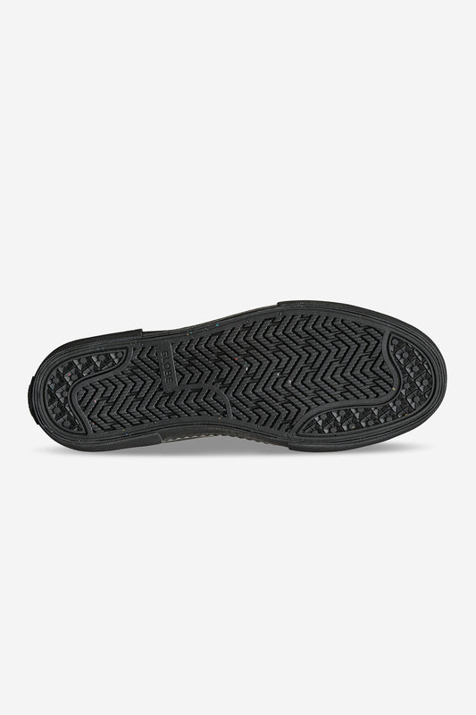 The Dover II - Black Crazyhorse features a black rubber sole with a textured tread of zigzag and diamond shapes, providing excellent grip for Chelsea Boots—ideal for walking or skateboarding with reliable traction.