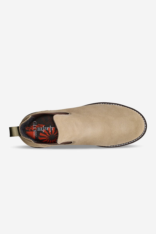 Top view of the Dover II Vibram - Taupe/MSFT: a beige suede slip-on Chelsea boot with visible stitching on the Vibram outsole, green heel pull tab, and patterned insole with red and black details and "Glory" partially visible.