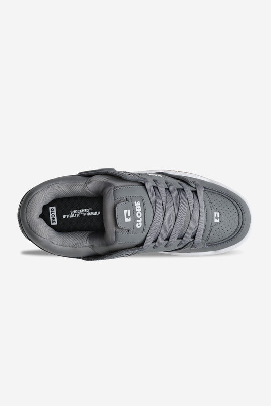 A top view of the Fusion - Charcoal/White skate shoe shows flat gray laces, a padded tongue with the Globe logo, and an insole reading SHOCKBED INNITOLITE FORMULA. The background is plain white.
