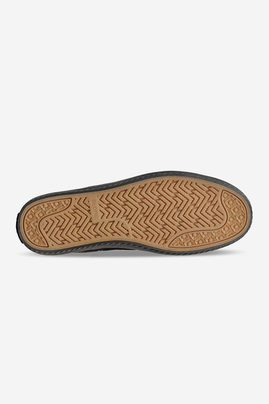 The image shows the sole of the Melbek - Black/Montano skate shoe with an abrasion-resistant, light brown rubber outsole and black edges featuring a textured, non-slip pattern, photographed against a white background.