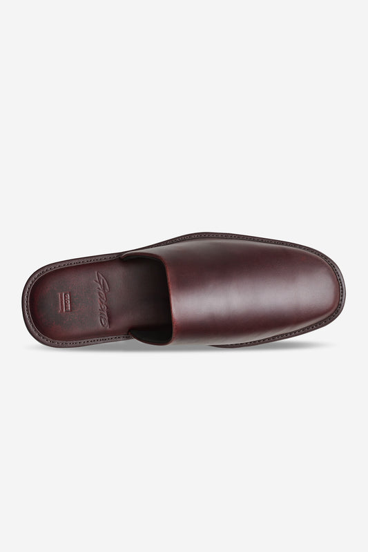 Top view of the Mule - Oxblood/Gillette: a single brown leather slip-on loafer with closed toe, open back, minimal stitching, and smooth premium leather finish.