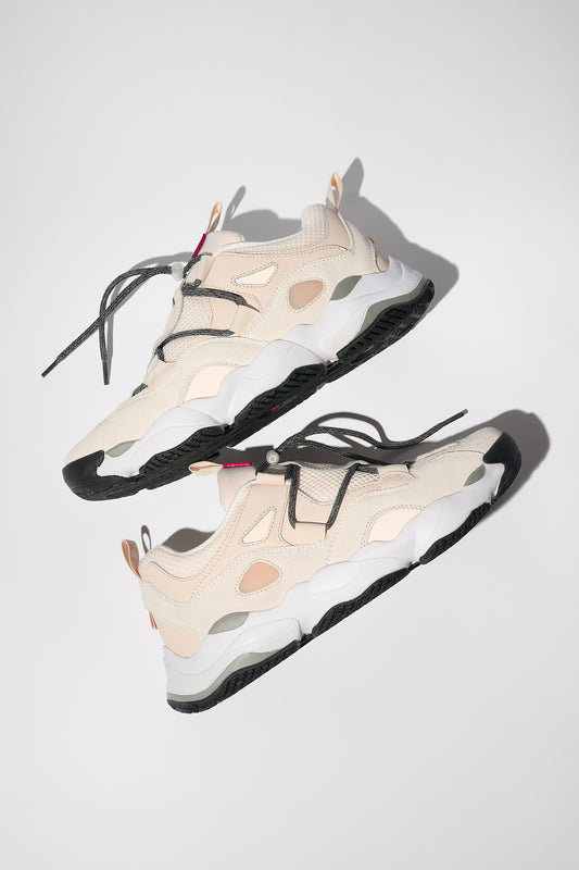 Two Option Evo - Stone/Vanilla sneakers with chunky white and black soles are placed side by side on a light background. They feature beige details, gray laces, and a Nitrolite EVA midsole for lightweight comfort.