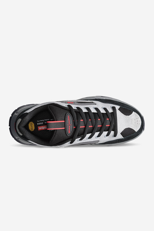 Top view of the RMS-3000 - Smoke/Black pro shoe in black, white, and gray with red accents, black laces, and a branded tongue label. Rodney Mullen-inspired design with a Vibram EVA sole ensures sporty style and enhanced comfort.