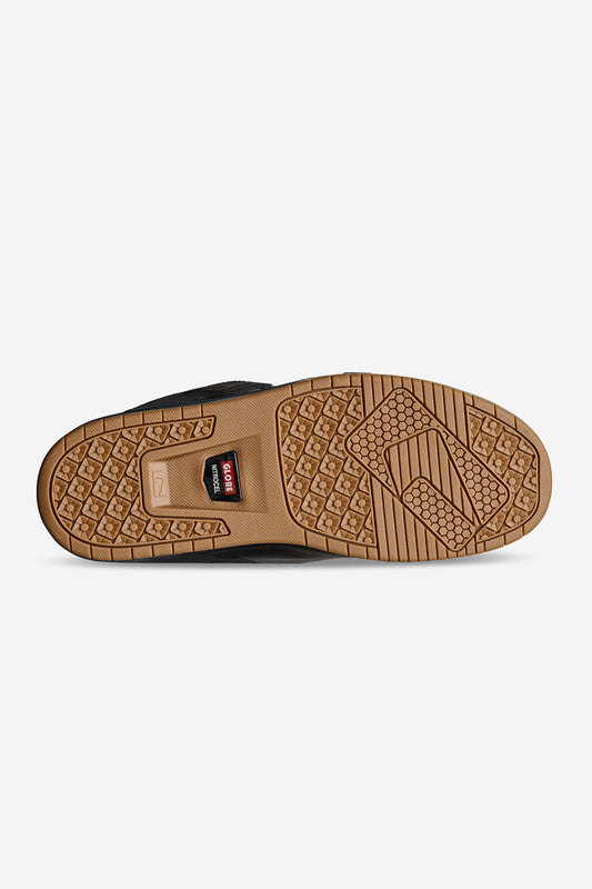 The image shows the sole of the Sabre - Dark Shadow/Phantom shoe with a tan rubber tread, diamond and rectangular textured grips, a visible logo, and a raised arch area for added traction.