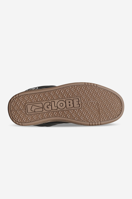 The image shows the sole of the Tilt - Onyx/Gum shoe, featuring a brown textured S-Trac pattern with GLOBE and the brand’s logo embossed in the center.