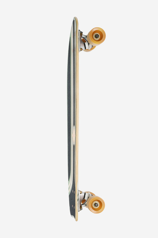 A top-down view of the Sidewalk Slider Cruiserboard 28" - Green/Croc, positioned vertically on its side, highlighting the black grip tape, wooden edges, and orange wheels against a white background.