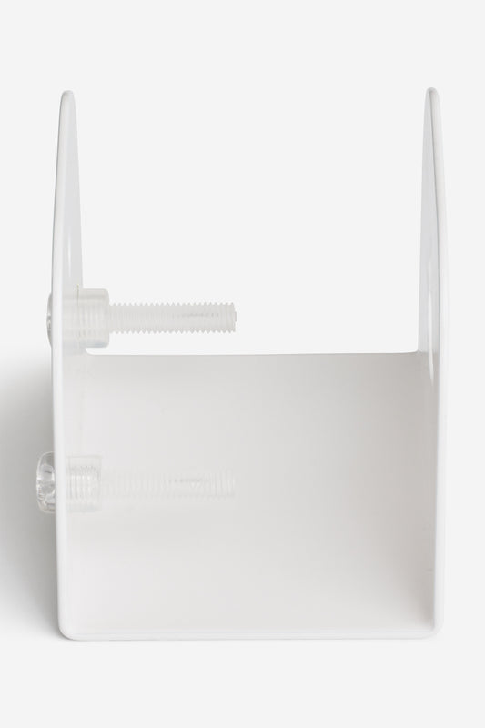 The "Skateboard Deck Wall Hanger Accessories Hg 1sz" in white features two adjustable clear acrylic deck bolts on one side to securely hold decks upright. Shown from the front, it's displayed against a plain white background.