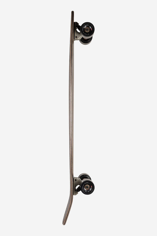 A side view of the Byron Bay Longboard 43" - Ebony/Nightshade shows its squash tail and curved Resin-8 hard rock maple deck with black cruiser wheels, set against a plain white background.