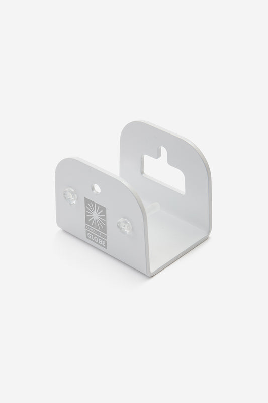 A compact white metal wall bracket with rounded edges, front logo, two screws, and a keyhole slot. The tall back panel with cut-out is ideal for displaying the Eames Silhouette Deck Deck 8.0" - Plywood Sculpture.