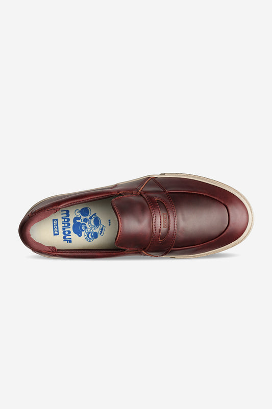 Top view of the Liaizon - Oxblood/Maalouf: a premium burgundy leather loafer with a white sole, showcasing a blue Marni x Carhartt logo and cartoon graphic on the insole—classic style meets skate-inspired design.