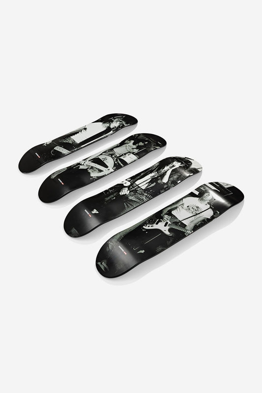 Four Ramones Collector's Set Deck 8.25" - On Stage skateboards, made from Resin-7 Canadian maple, are arranged in a row with black-and-white graphics forming a larger image of a person holding a guitar.