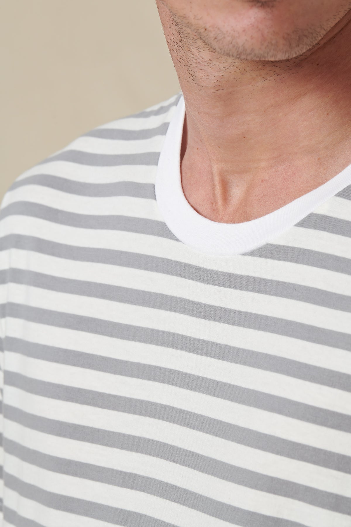 front collar of Globe white striped tee