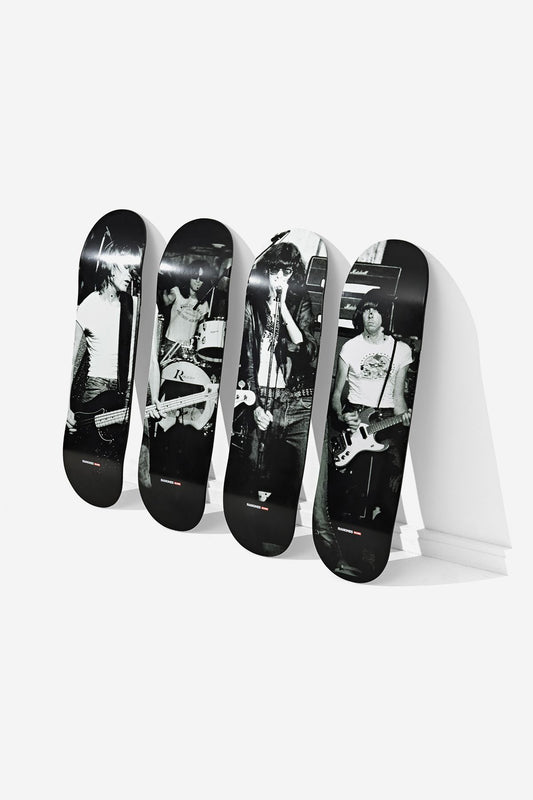 Four limited edition Ramones Collector's Set Deck 8.25" - On Stage skateboard decks stand upright, each displaying a black-and-white live band photo that combines to form a single group image.