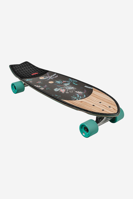 The Sun City Cruiserboard 30" - Olivewood/Neon Jungle features teal wheels, black grip tape with floral and owl designs, and natural wood nose and tail accents in Resin-7 hard rock maple, shown on a white background.